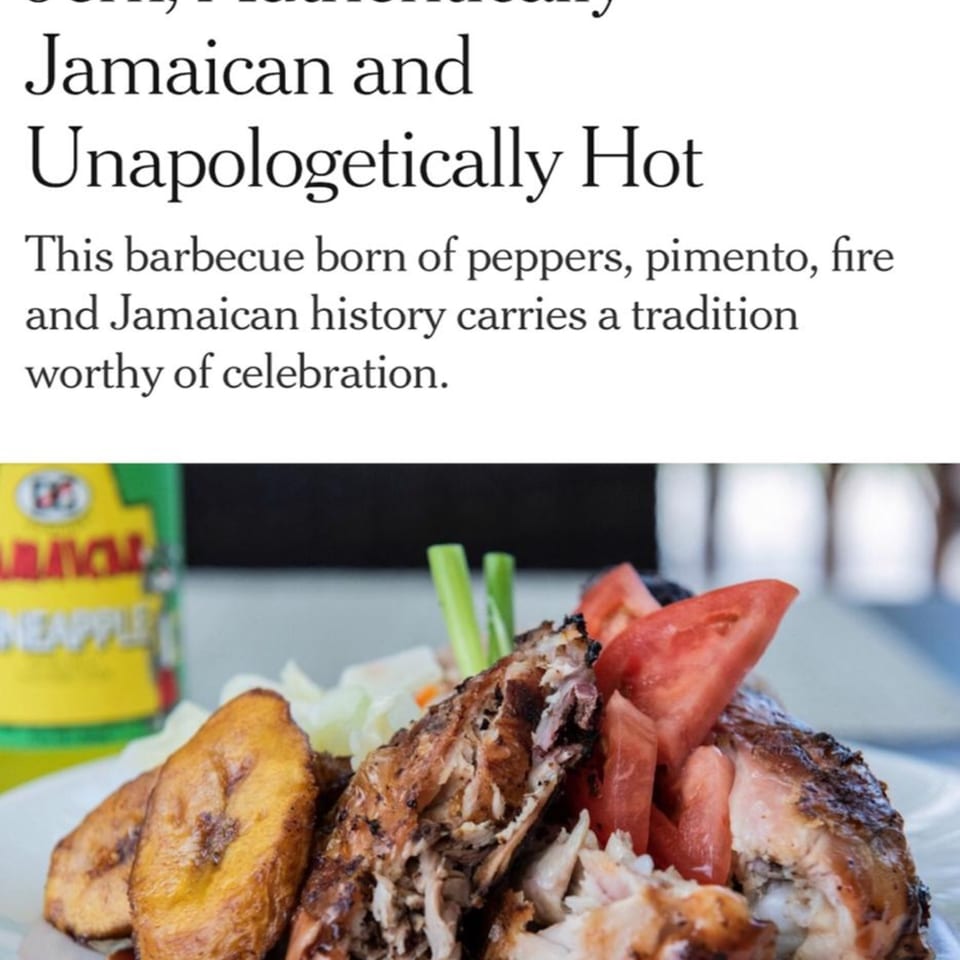 Close-up of Mr Mack's Jamaican jerk chicken with fried plantains, tomatoes, and a pineapple drink.